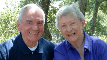 Larry Coons and his wife pose for a photo