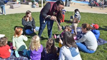 Mel Sarmento provides an educational moment for a group of kids