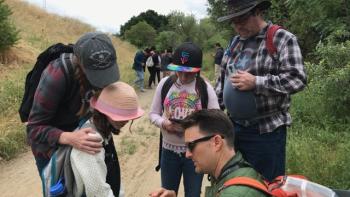 A group of parents and children talking 