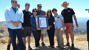Mike Flaugher along with fellow board members and OSA staff hold a framed certificate