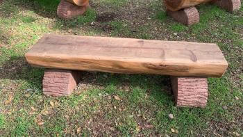 small wooden bench on grass