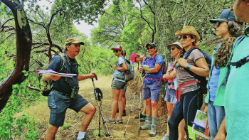 Group of people hiking on a trail