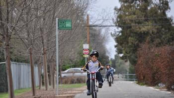 Children biking on a trail