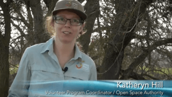 A photo of a woman in Open Space Authority gear with a title card that reads "Katheryn Hill, Volunteer Program Coordinator, Open Space Authority."