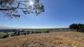 Photo of golden field overlooking farmland in Gilroy