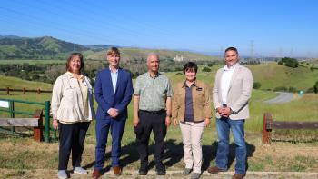 Speakers stand together during the Power Santa Clara press conference on March 20, 2026