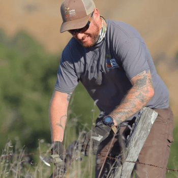 Open Space Technician Stephen removes barbed wire fencing from MOCR