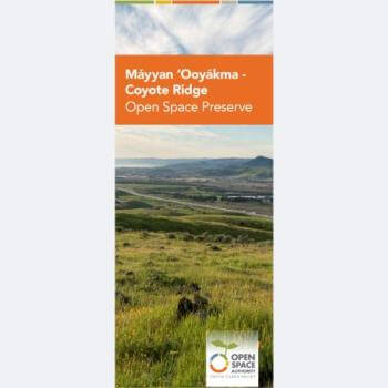 The cover of a brochure with the title Máyyan 'Ooyákma – Coyote Ridge Open Space Preserve in an orange banner over a landscape photo of green grass looking over a valley