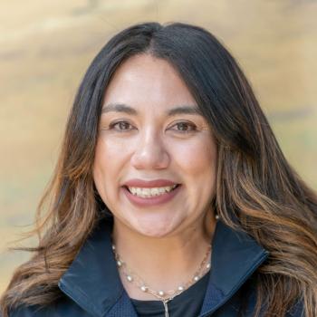Lisanna Dominguez headshot photo smiling at the camera