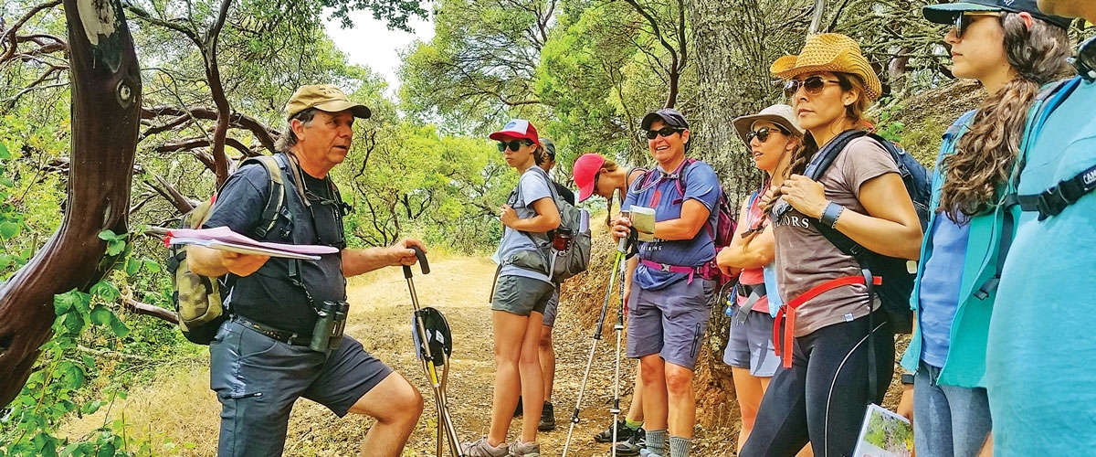 Group of hikers laughing on trail at Rancho Cañada del Oro Open Space Preserve