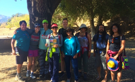 Group of smiling people standing in front of tree at Rancho Cañada del Oro Open Space Preserve