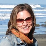 Megan Dreger headshot with ocean in background